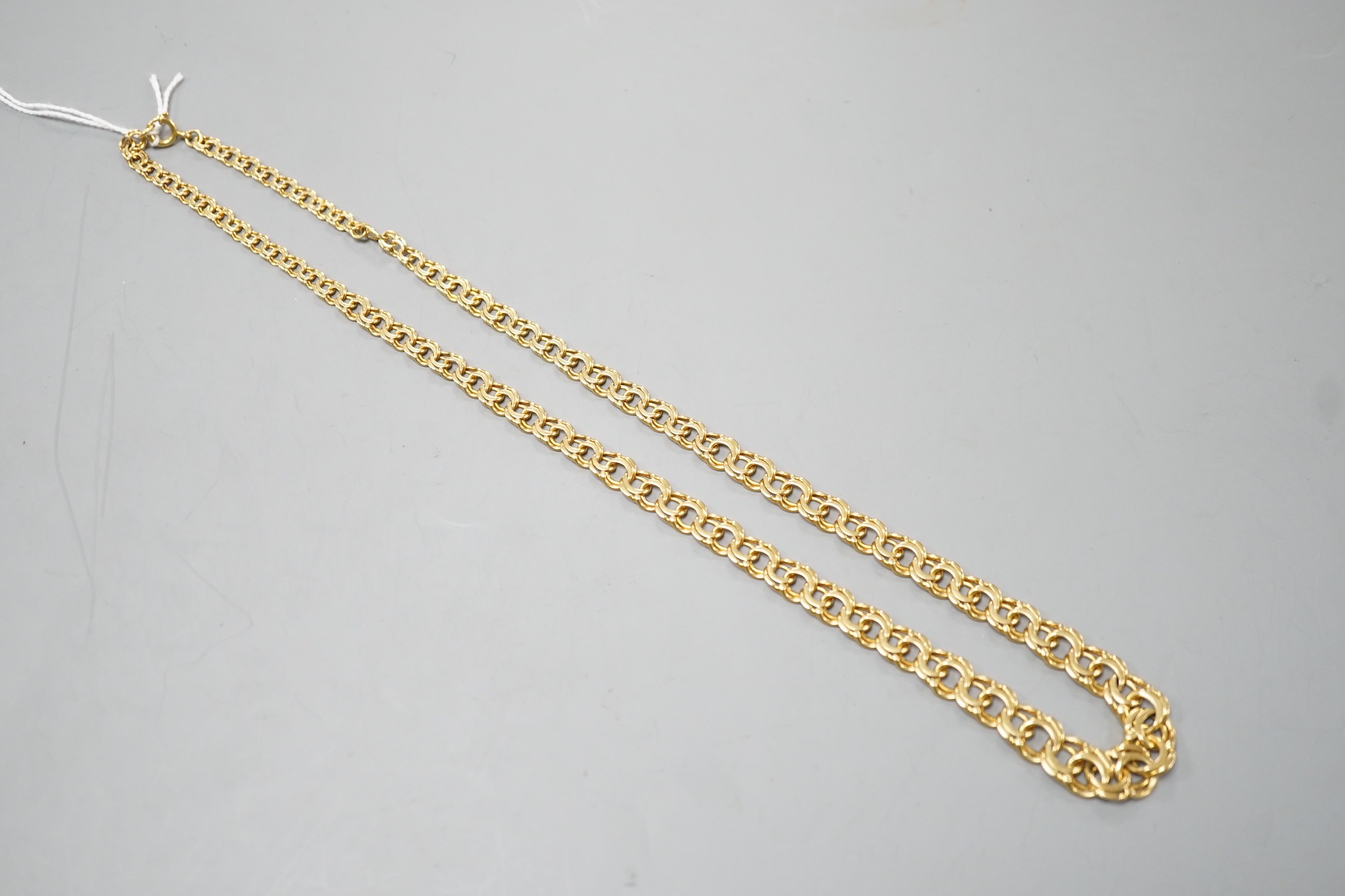 A yellow metal graduated interwoven circular link necklace, 53cm, 42.1 grams.